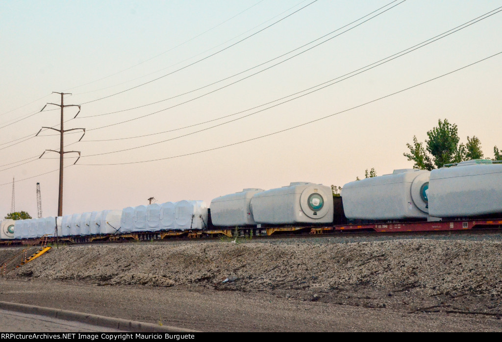 QTTX & KRL Flat cars with load in the yard